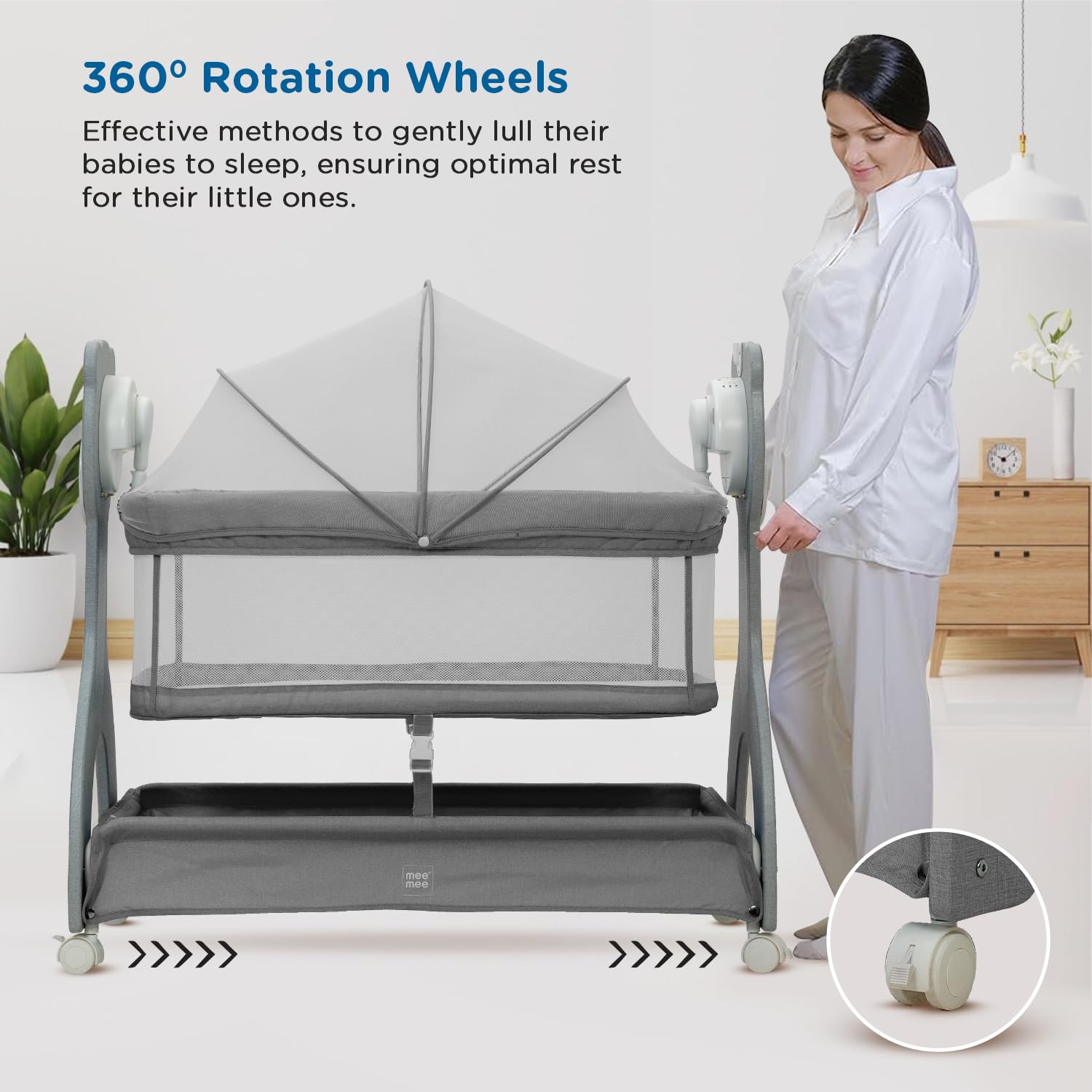 Grey Mee Mee infant cradle with mesh sides, overhead mobile with stars and moon, and a convenient remote control for soothing. www.usmile.toys
